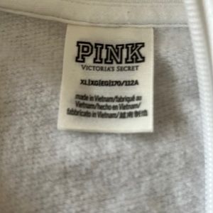 White Pink Pullover with Multi-colored letters .